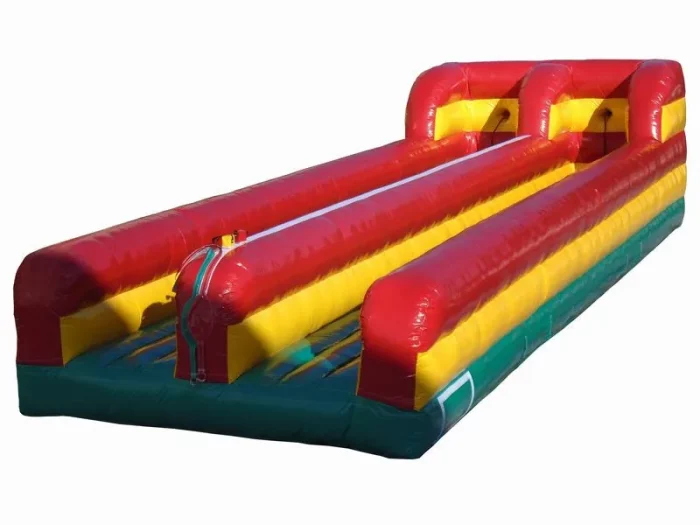 Inflatable bungee run bouncy castle in red, yellow, and green, ideal for competitive fun at events. Buy online in NZ at affordable prices.