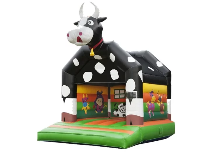 Cow-themed inflatable bouncy castle with a large cow design and farm animal graphics, perfect for kids' parties. Buy online in NZ today!