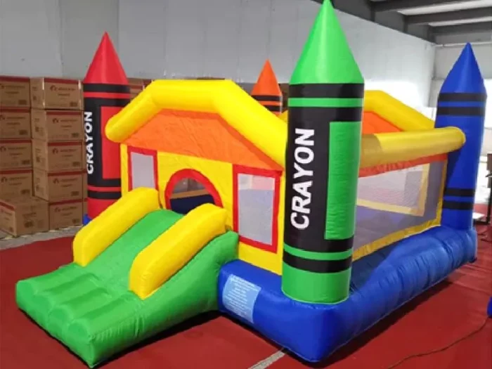 Crayon-themed inflatable bouncy castle with slide and colorful design, perfect for kids' parties. Buy online in NZ for affordable fun and entertainment.